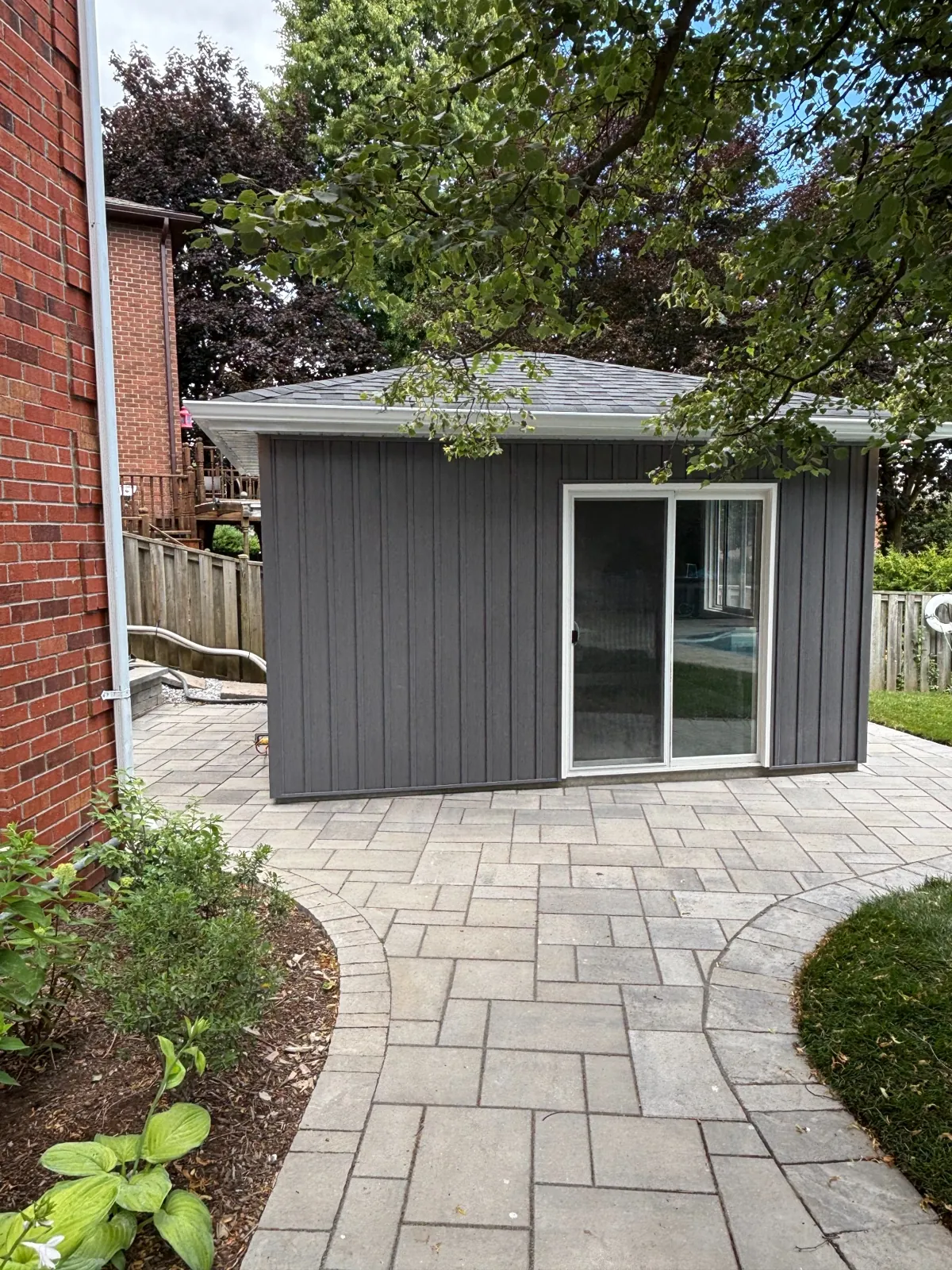 Backyard Shed & Patio Renovation – Whitby Project Backyard renovation with custom shed and interlocking stone patio in Durham Region