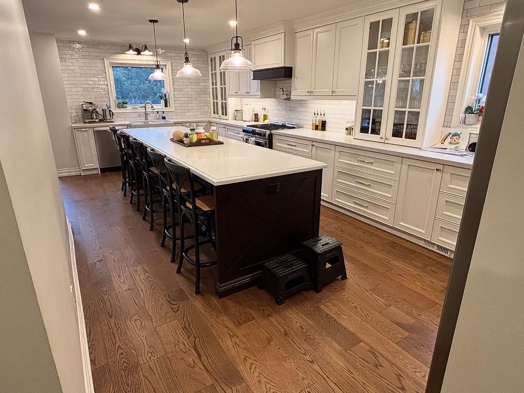 Modern kitchen island installation in Ajax with pendant lighting and bar seating