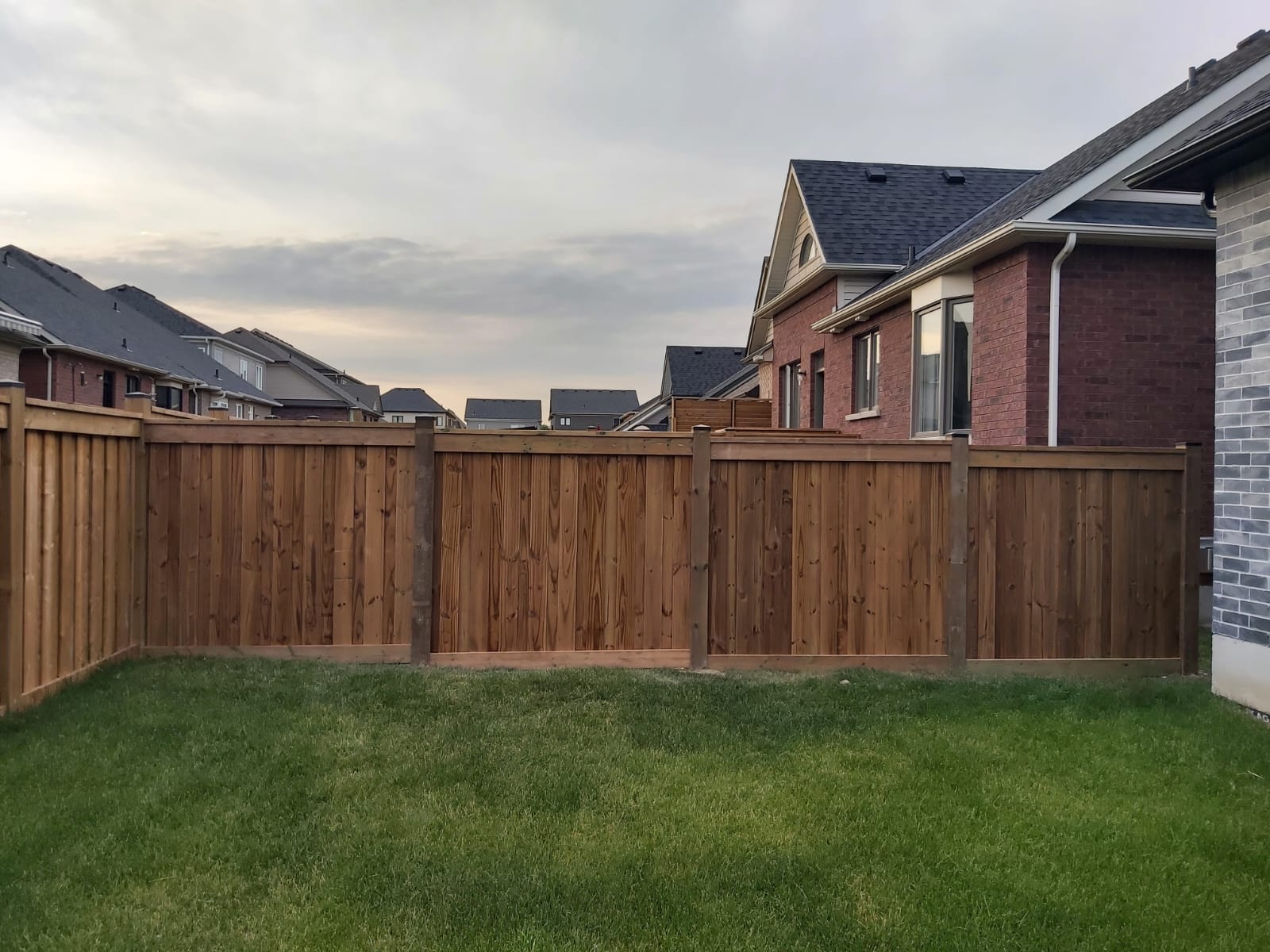 Bowmanville Fence Installation – Wilworks Renovations Wood privacy fence installation between homes in Bowmanville subdivision